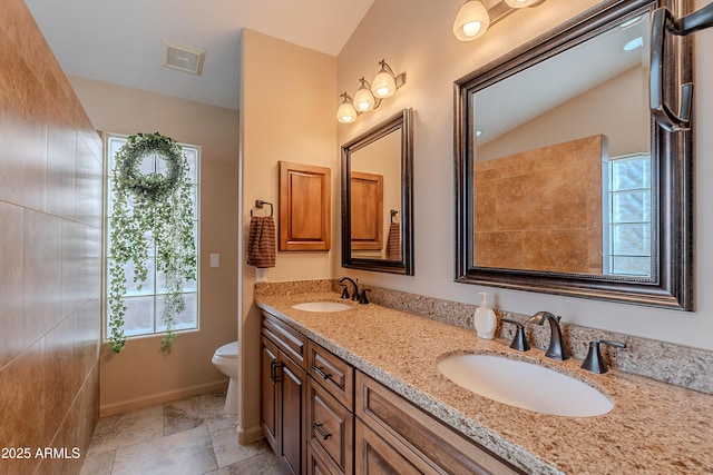 490 W Encinas St, Gilbert, AZ 85233 - bathroom featuring toilet, double vanity, and plenty of natural light