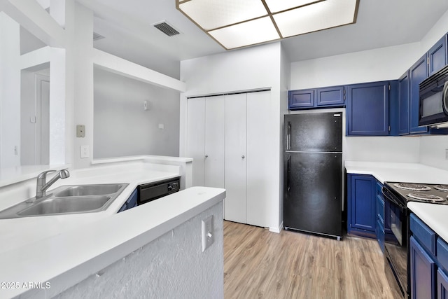 kitchen with blue cabinetry, light wood-type flooring, sink, and black appliances