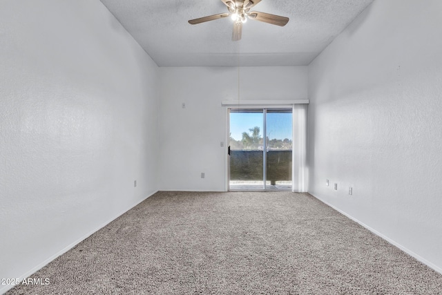 carpeted empty room featuring a textured ceiling and ceiling fan