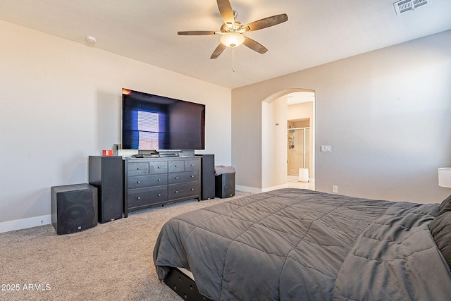 bedroom featuring arched walkways, light colored carpet, a ceiling fan, baseboards, and visible vents