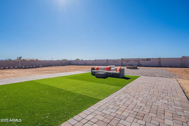 view of yard featuring an outdoor hangout area, a patio area, and a fenced backyard