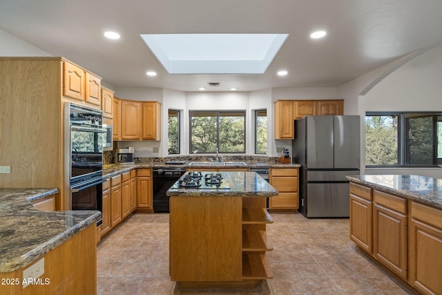 kitchen featuring open shelves, recessed lighting, a sink, dark stone counters, and black appliances