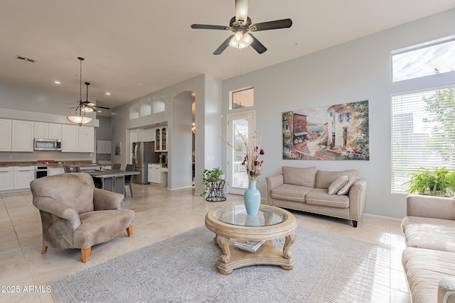 9678 E Voltaire Dr, Scottsdale, AZ 85260 - living room featuring a ceiling fan, healthy amount of natural light, light tile patterned floors, and recessed lighting