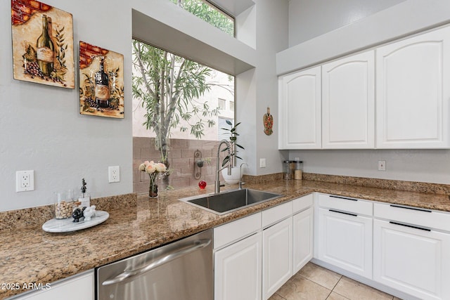 9678 E Voltaire Dr, Scottsdale, AZ 85260 - kitchen with dishwasher, a sink, white cabinets, light stone countertops, and light tile patterned floors