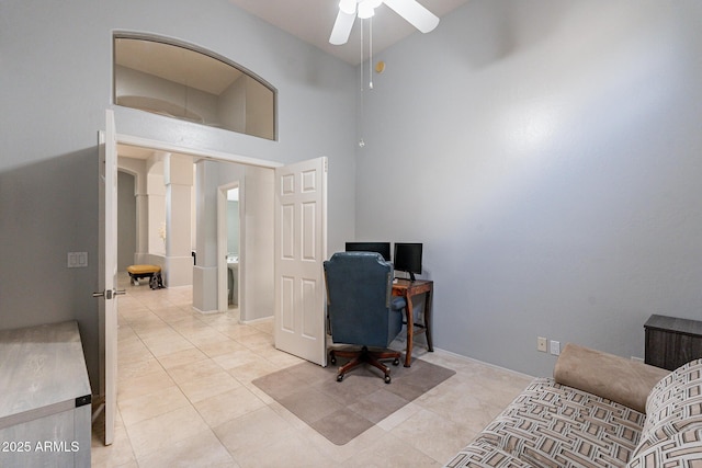9678 E Voltaire Dr, Scottsdale, AZ 85260 - home office featuring ceiling fan, light tile patterned floors, and a towering ceiling