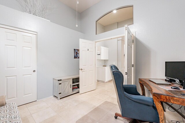 9678 E Voltaire Dr, Scottsdale, AZ 85260 - home office featuring a towering ceiling and light tile patterned floors