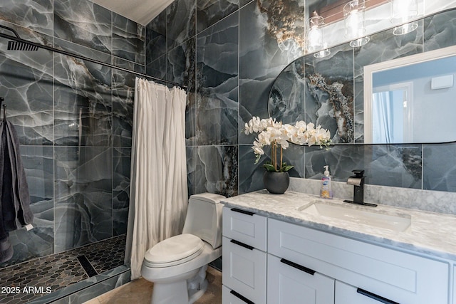 9678 E Voltaire Dr, Scottsdale, AZ 85260 - bathroom with tile walls, a tile shower, vanity, and toilet