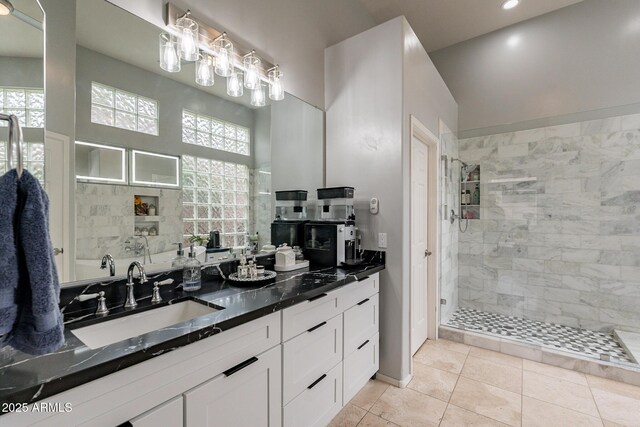 9678 E Voltaire Dr, Scottsdale, AZ 85260 - bathroom with double vanity, a walk in shower, tile patterned floors, and recessed lighting