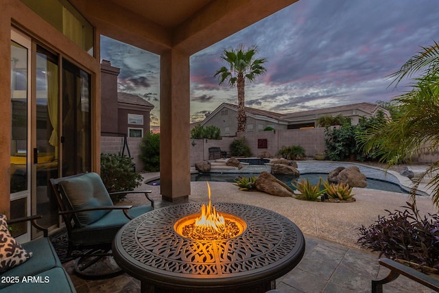 9678 E Voltaire Dr, Scottsdale, AZ 85260 - patio terrace at dusk featuring a fire pit, a patio, and a fenced backyard