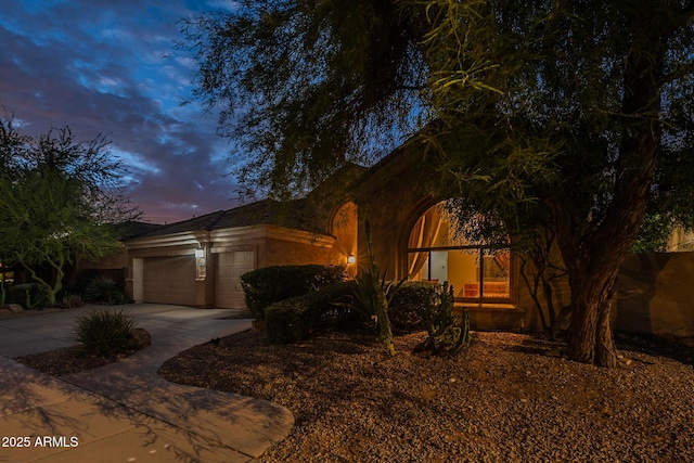 9678 E Voltaire Dr, Scottsdale, AZ 85260 - view of front of home with driveway, stucco siding, and an attached garage