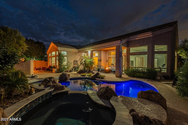 9678 E Voltaire Dr, Scottsdale, AZ 85260 - pool at twilight with a patio area and a pool with connected hot tub