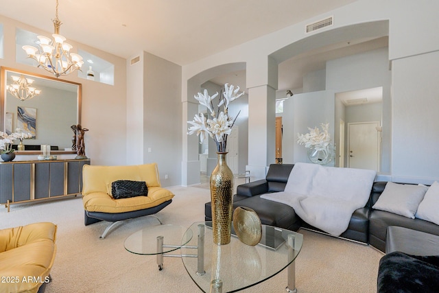 9678 E Voltaire Dr, Scottsdale, AZ 85260 - living area featuring carpet flooring, a chandelier, and arched walkways