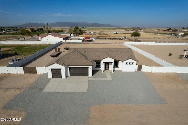 birds eye view of property with a mountain view