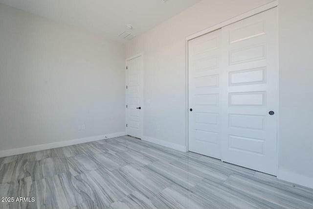 unfurnished bedroom featuring a closet