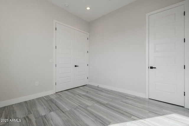 unfurnished room with light hardwood / wood-style floors