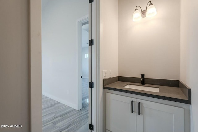 bathroom featuring vanity and hardwood / wood-style flooring