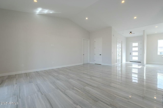 empty room featuring lofted ceiling