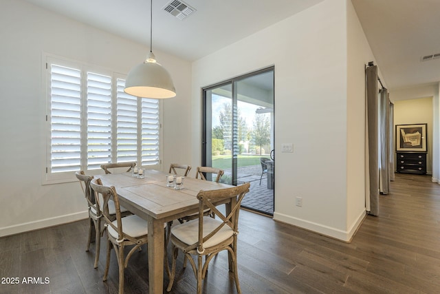 dining space featuring dark hardwood / wood-style flooring