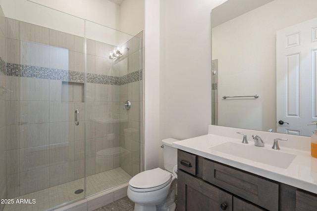 bathroom featuring vanity, toilet, and walk in shower