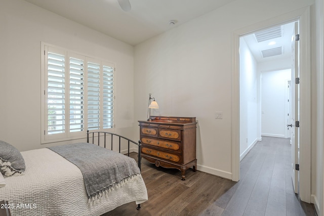 bedroom featuring dark hardwood / wood-style floors and ceiling fan