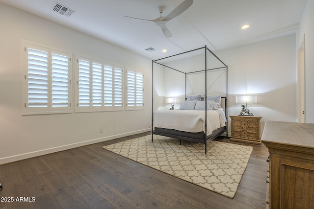 bedroom with ceiling fan and dark hardwood / wood-style floors