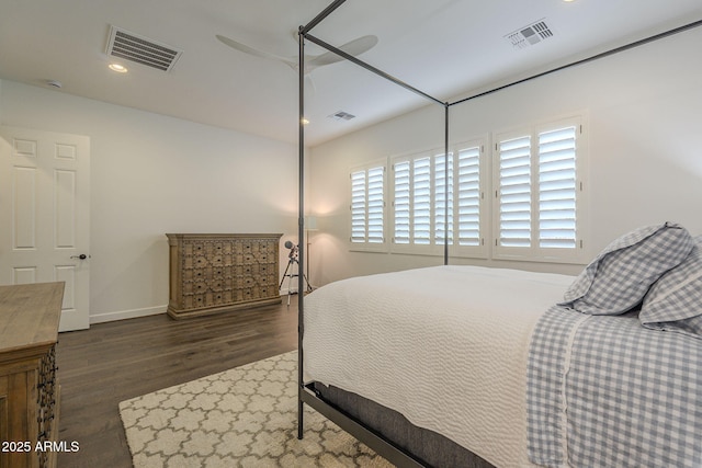 bedroom with dark wood-type flooring and ceiling fan