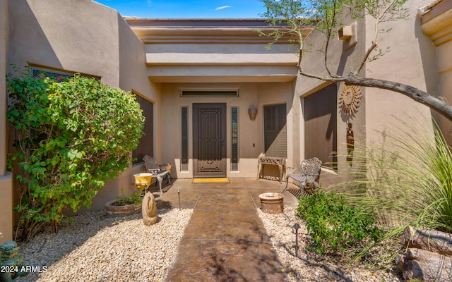 doorway to property featuring a patio