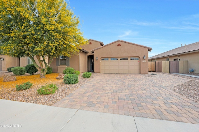 3359 E Penedes Dr, Gilbert, AZ 85298 - mediterranean / spanish-style house featuring driveway, an attached garage, fence, and stucco siding