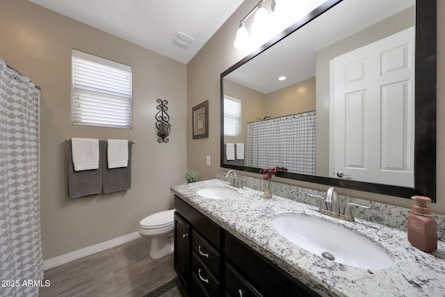 3359 E Penedes Dr, Gilbert, AZ 85298 - bathroom featuring baseboards, toilet, double vanity, a shower with curtain, and wood finished floors
