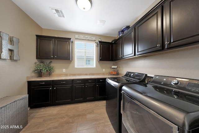 3359 E Penedes Dr, Gilbert, AZ 85298 - laundry area featuring cabinet space, separate washer and dryer, and light wood-type flooring