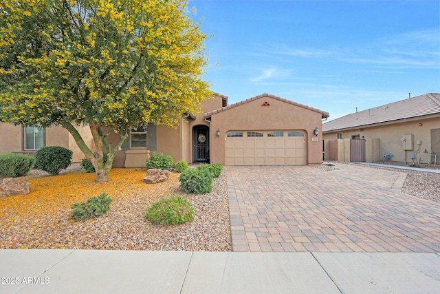 3359 E Penedes Dr, Gilbert, AZ 85298 - view of front of home featuring a garage, decorative driveway, stucco siding, fence, and a tile roof