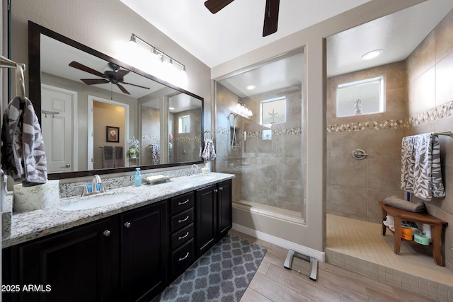 3359 E Penedes Dr, Gilbert, AZ 85298 - full bathroom featuring a ceiling fan, walk in shower, double vanity, and wood finished floors