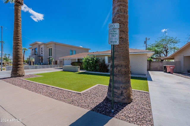 exterior space featuring fence and driveway