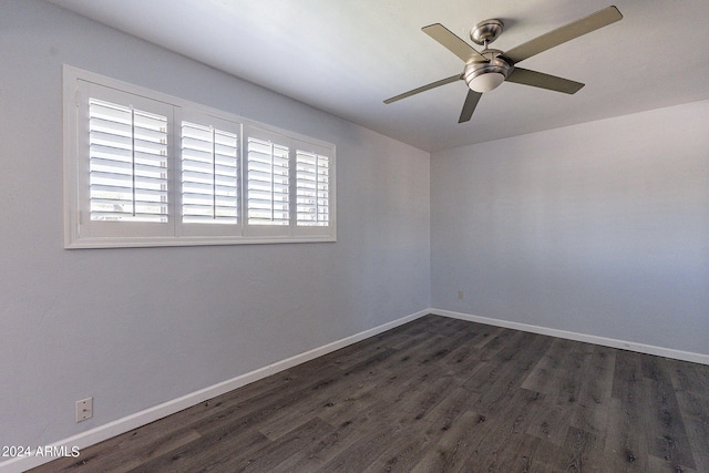 unfurnished room featuring ceiling fan, baseboards, and dark wood finished floors