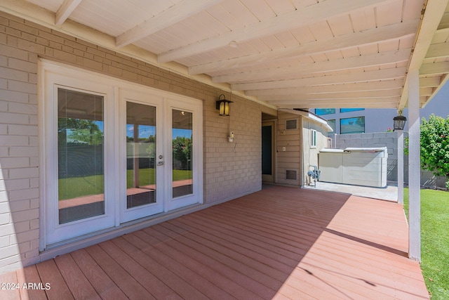 wooden deck featuring fence and french doors