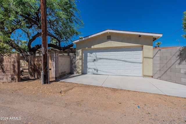 garage with fence