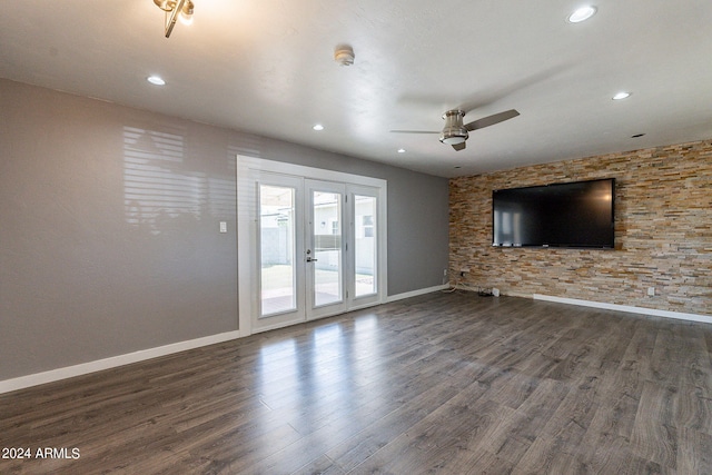 unfurnished living room featuring dark wood-type flooring, recessed lighting, and baseboards