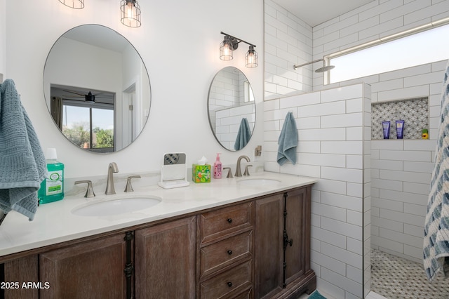 full bathroom featuring plenty of natural light, a walk in shower, and a sink