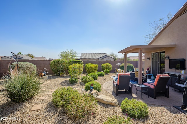 view of yard featuring a patio area, a fenced backyard, and outdoor lounge area