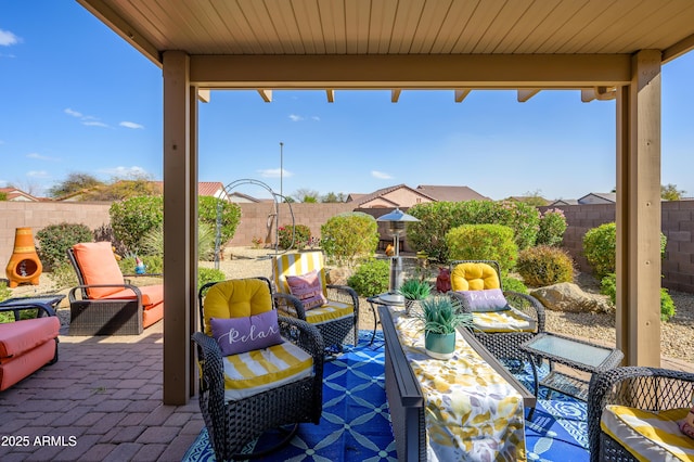 view of patio featuring a fenced backyard and an outdoor hangout area