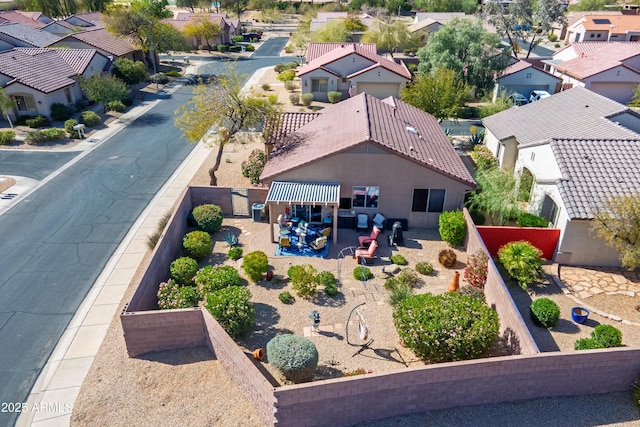 birds eye view of property with a residential view