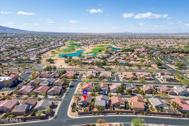 birds eye view of property with a mountain view and a residential view