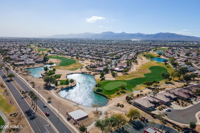 bird's eye view featuring golf course view, a residential view, and a water and mountain view