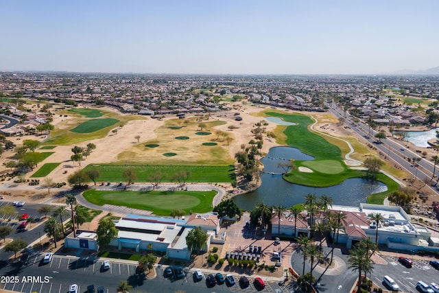 drone / aerial view featuring a water view and golf course view