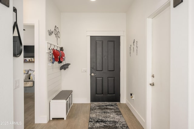 interior space with light wood-style flooring and baseboards