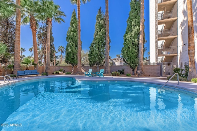 425 Paseo Redondo Unit 6L, Tucson, AZ 85701 - community pool with a fenced backyard and outdoor lounge area
