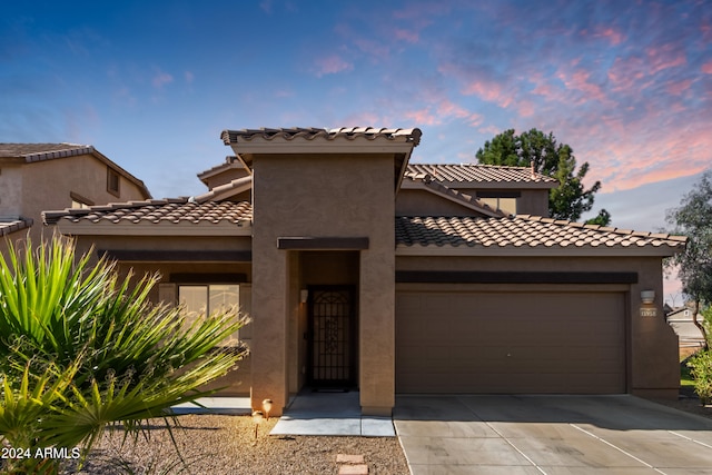 mediterranean / spanish-style house featuring a garage