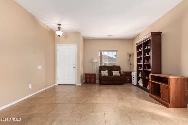 unfurnished room with light tile patterned floors