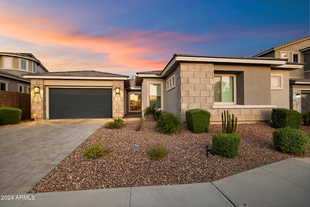 prairie-style home featuring a garage