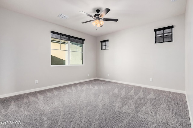 spare room with carpet and ceiling fan